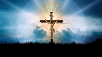 Jeesus ristillä ja suuri valo loistaa ristin takaa